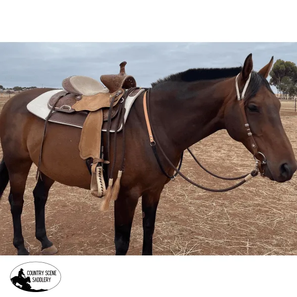 15" Double T Basket weave and Floral Tooled Barrel Style Saddle.